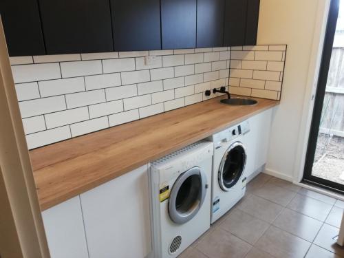 Laundry Gut and new cabinets and bench Kaboodle Installation